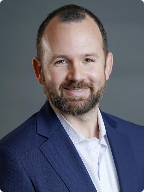 Matt Tinker, Certified Financial Planner, smiling for his portrait.